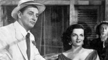Mitchum & Russell arrive in Macao shortly after she has picked his pocket of all ready cash!